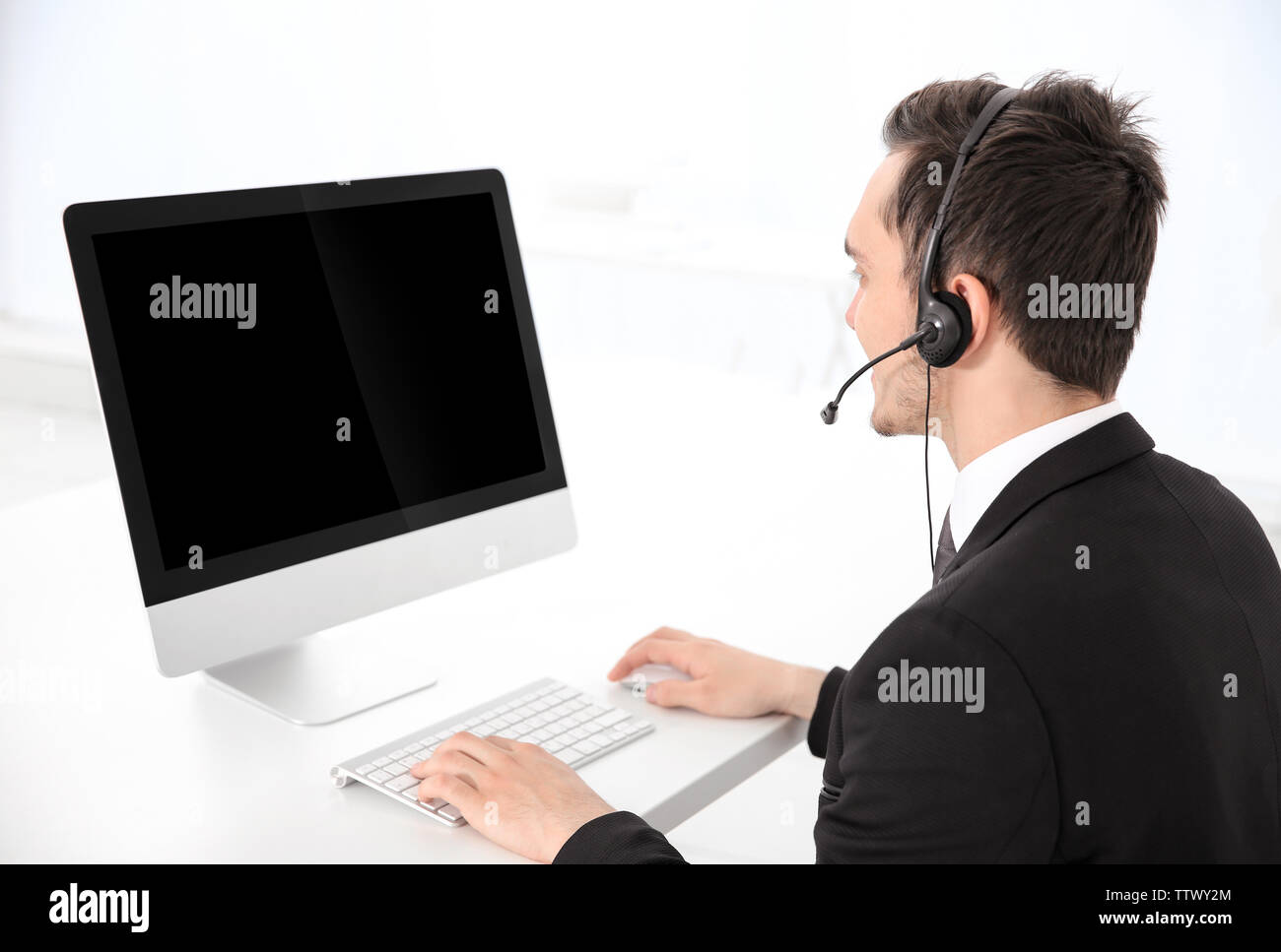 Operator with headset on monitor screen hi-res stock photography and ...