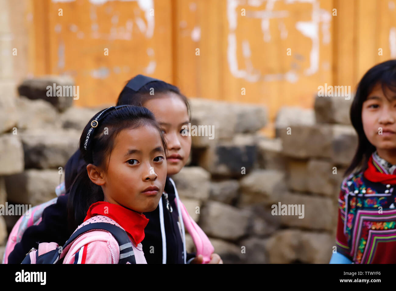 Young girls in a village near the rice fields of Yunnan, China. The famous terraced rice fields of Yuanyang in Yunnan province in China. Yunnan, China Stock Photo