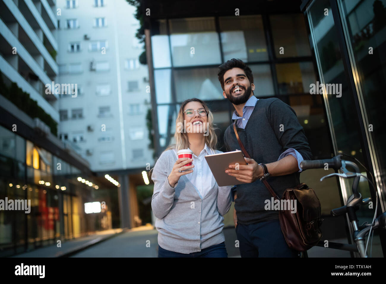 Happy young couple using a digital tablet together and smiling Stock ...