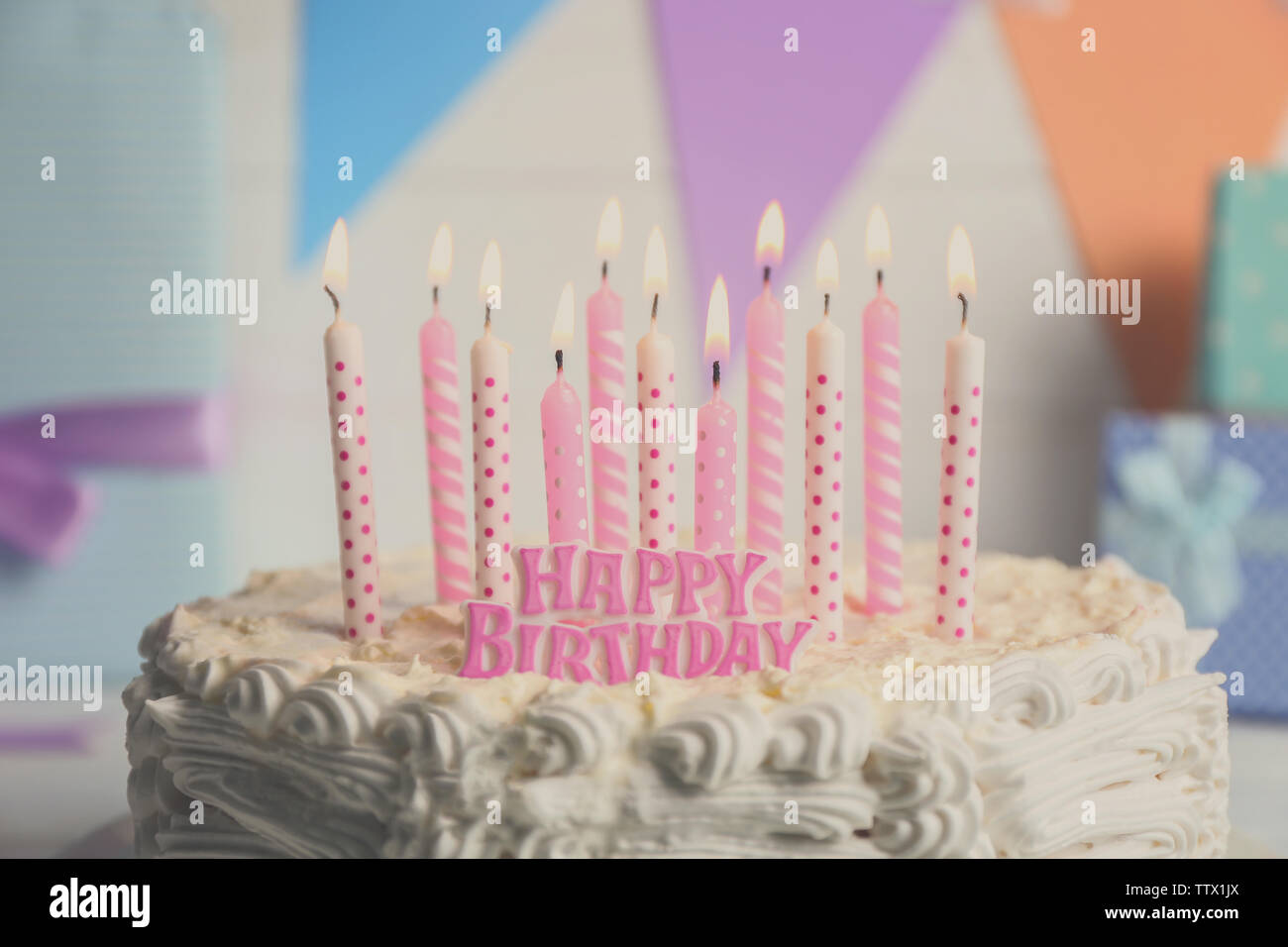 Birthday cake with candles on light background Stock Photo - Alamy