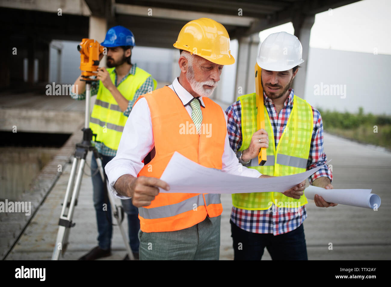 Architect working construction plan hi-res stock photography and images ...