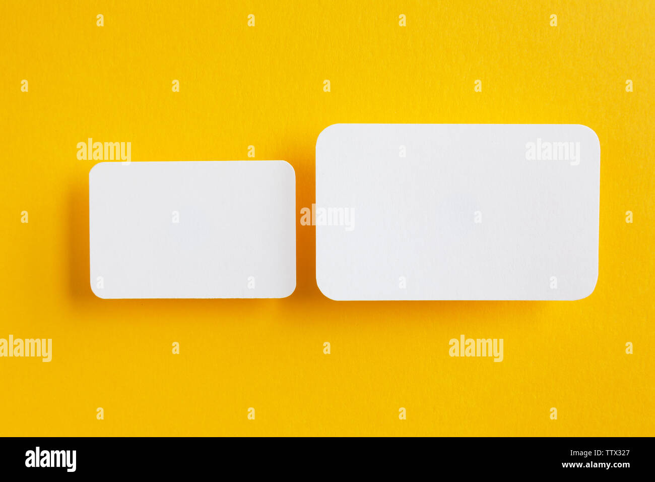 paper speech bubbles on yellow background Stock Photo - Alamy