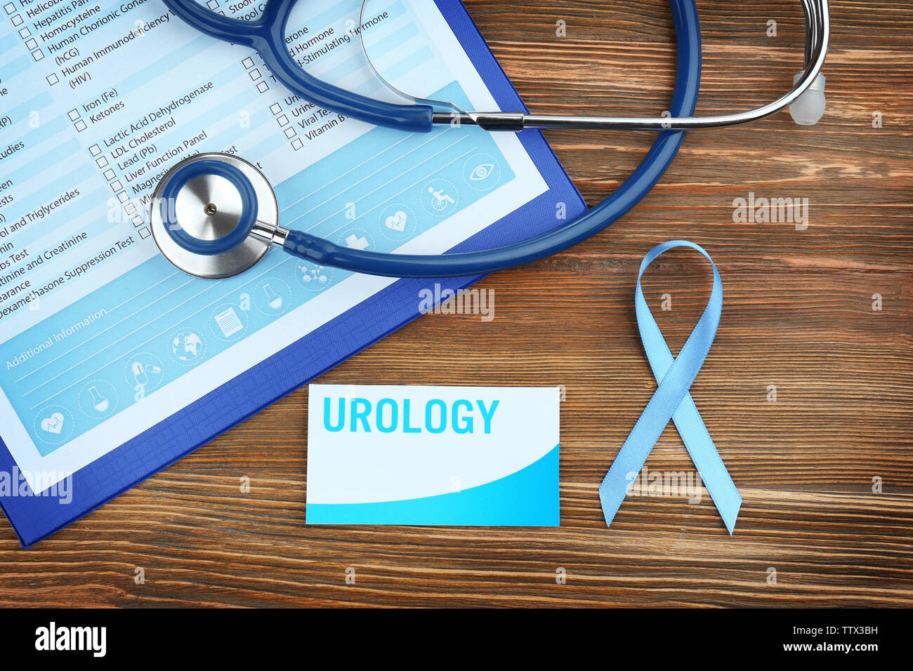 Stethoscope on laboratory test, card and ribbon on wooden background. Prostate cancer concept Stock Photo