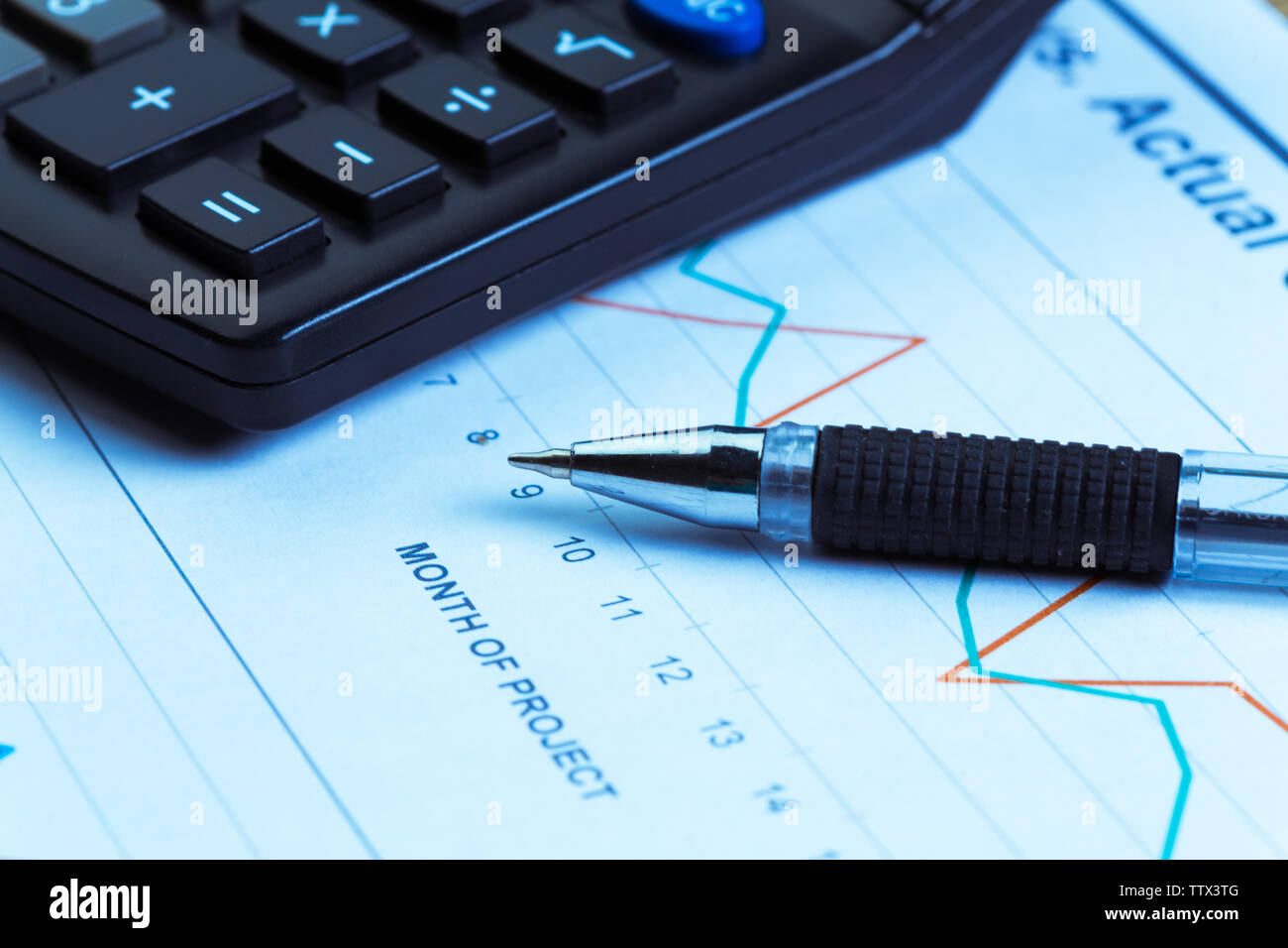 Graphs and Calculator Stock Photo - Alamy