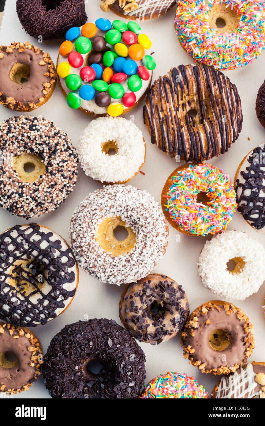 Close up of a selection of colorful donuts Stock Photo - Alamy