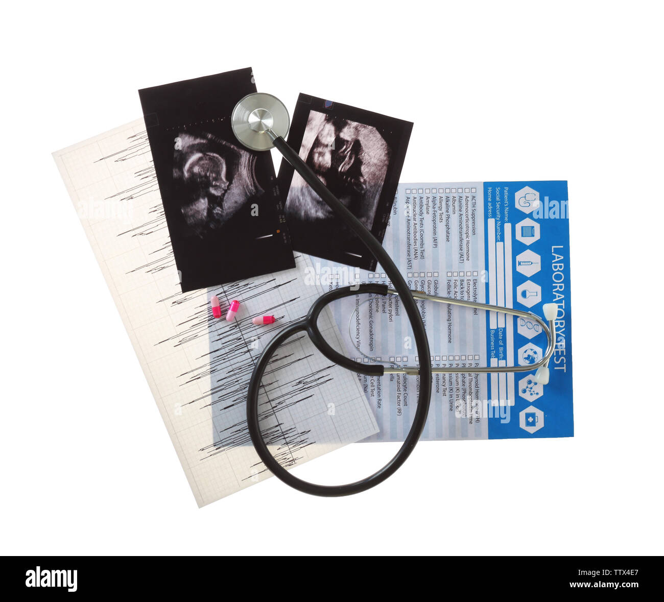 Ultrasound scan of baby with stethoscope and laboratory test on white