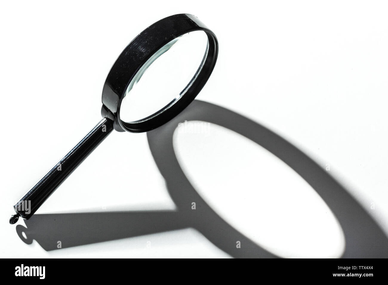 Magnifying glass isolated on white Stock Photo - Alamy