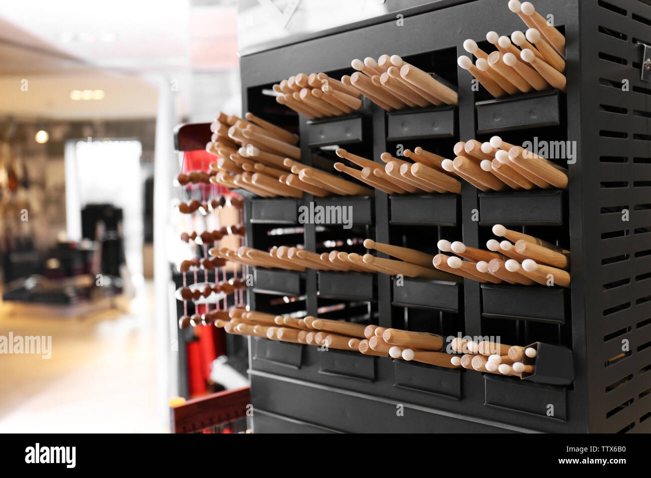 Drumsticks on shelves in music shop Stock Photo Alamy
