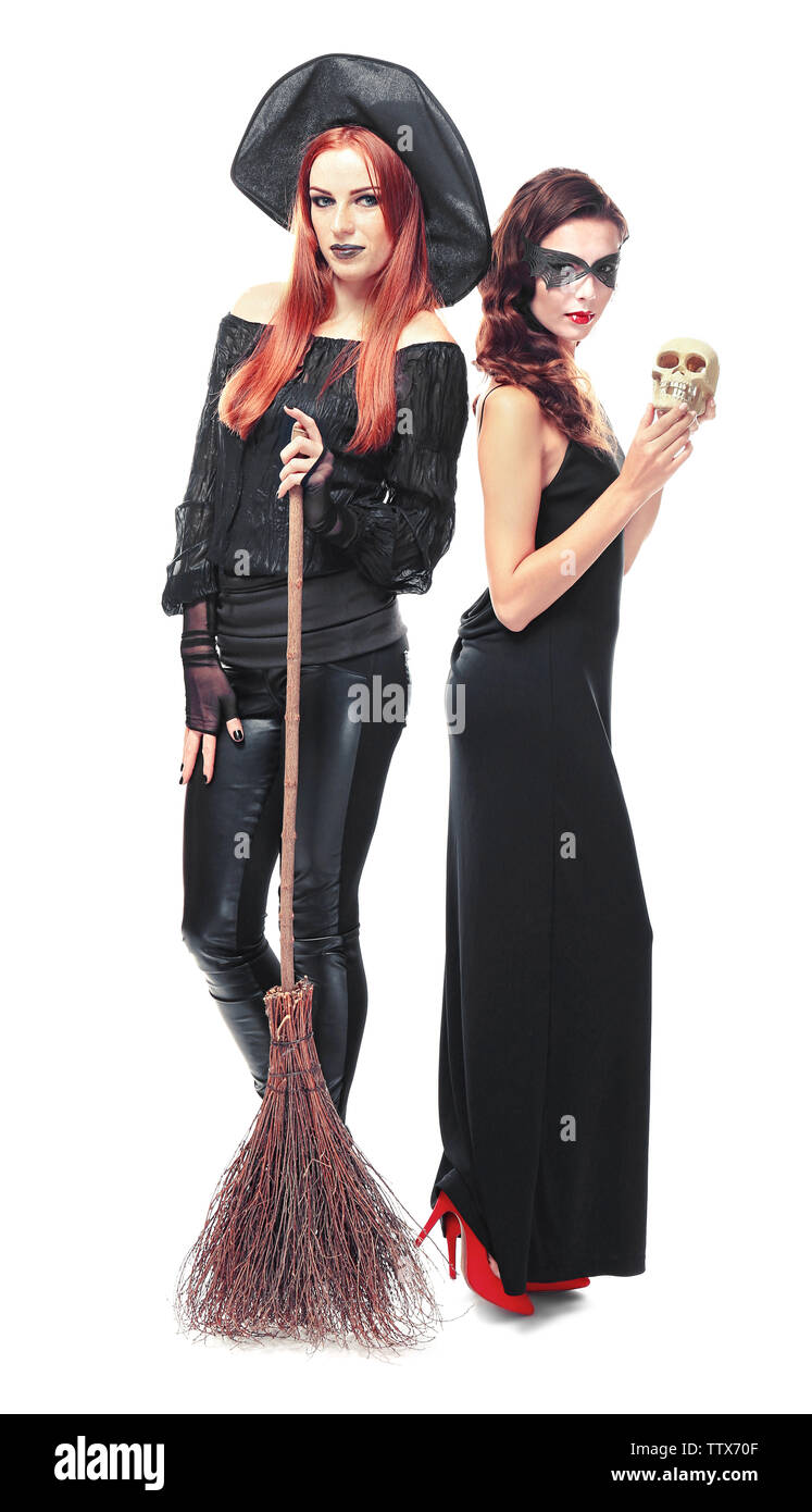 Young women dressed as witch and vampire for Halloween, isolated on white Stock Photo