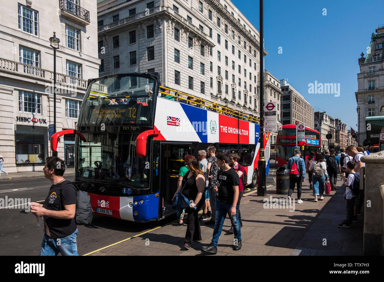 London Tour Bus on Piccadilly with people, London, England, U.K. Stock Photo