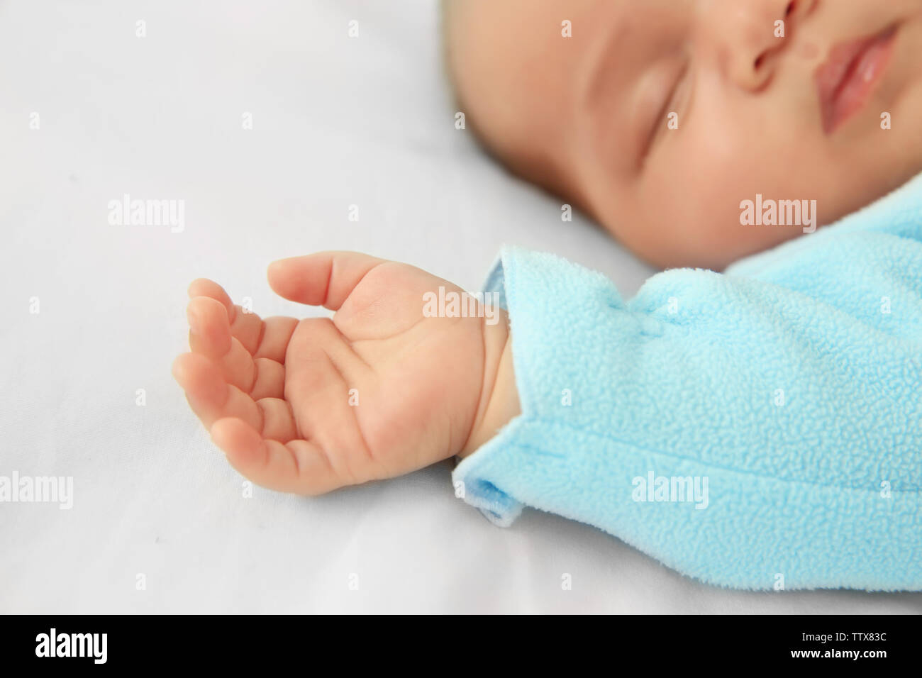 Cute baby sleeping on bed, closeup Stock Photo Alamy