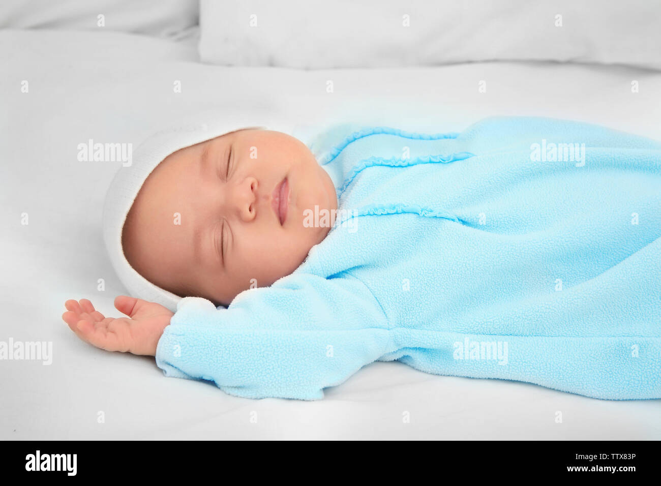 Cute baby sleeping on bed Stock Photo Alamy