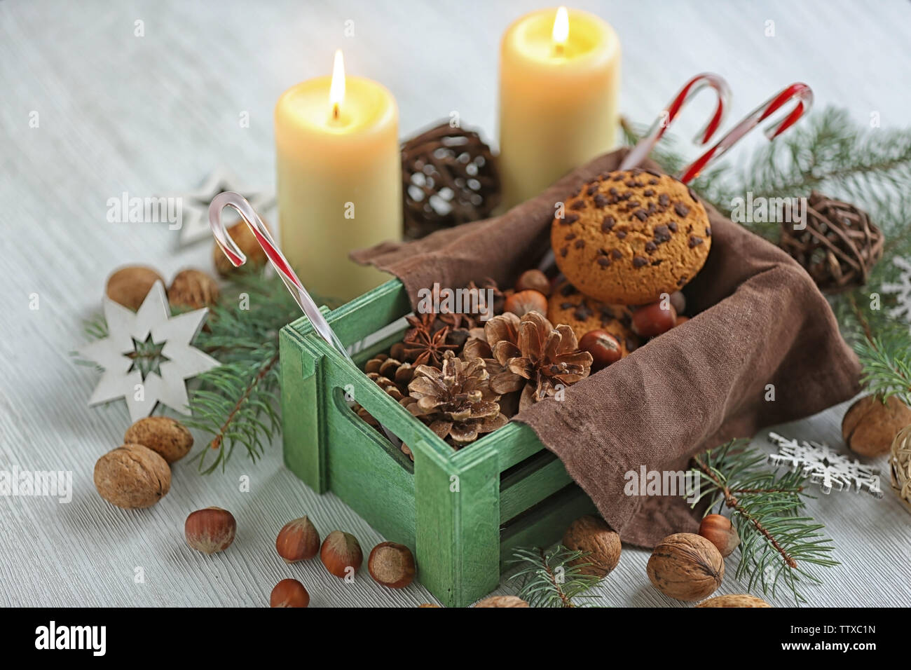 Green box with Christmas decoration on table Stock Photo