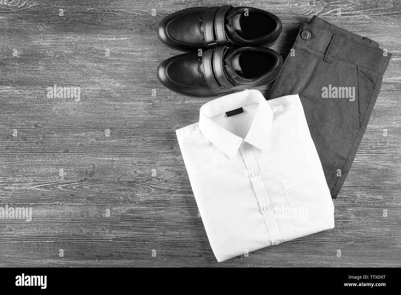 School uniform on wooden background Stock Photo