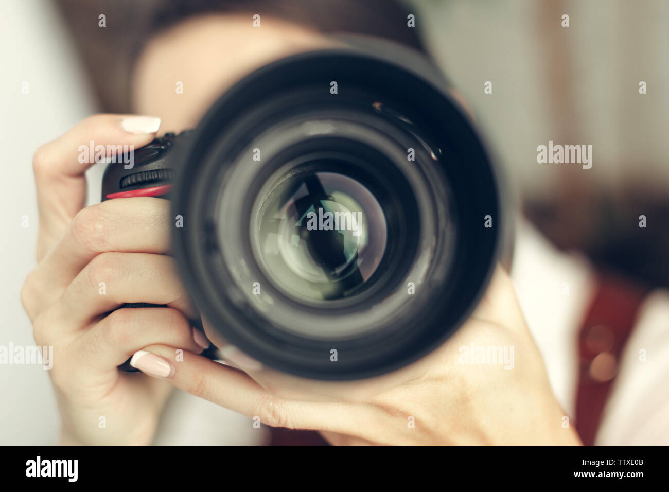 Pretty woman is a professional photographer with dslr camera Stock ...