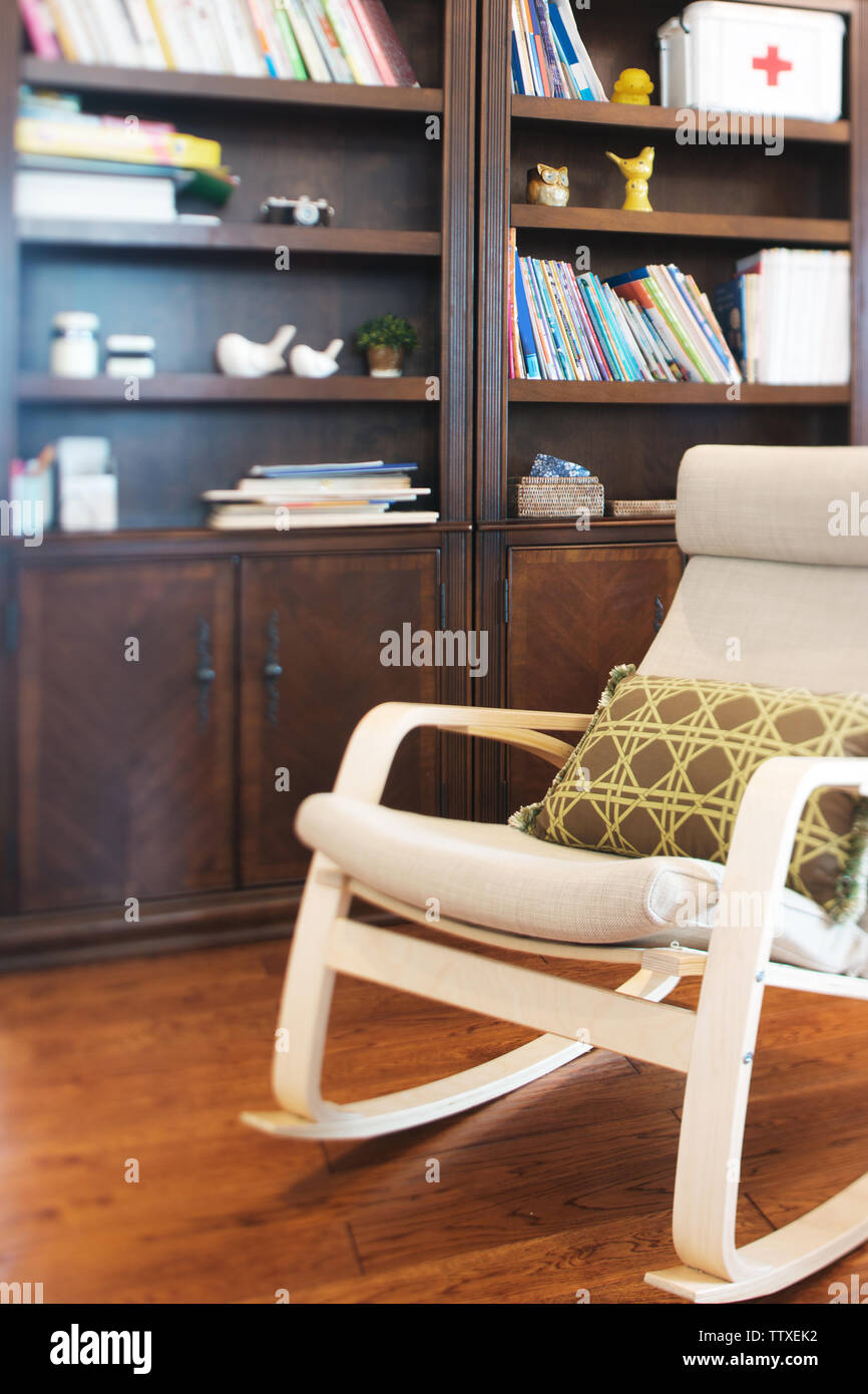 Elegant Armchair And Book Shelf In Modern Living Room Stock Photo Alamy