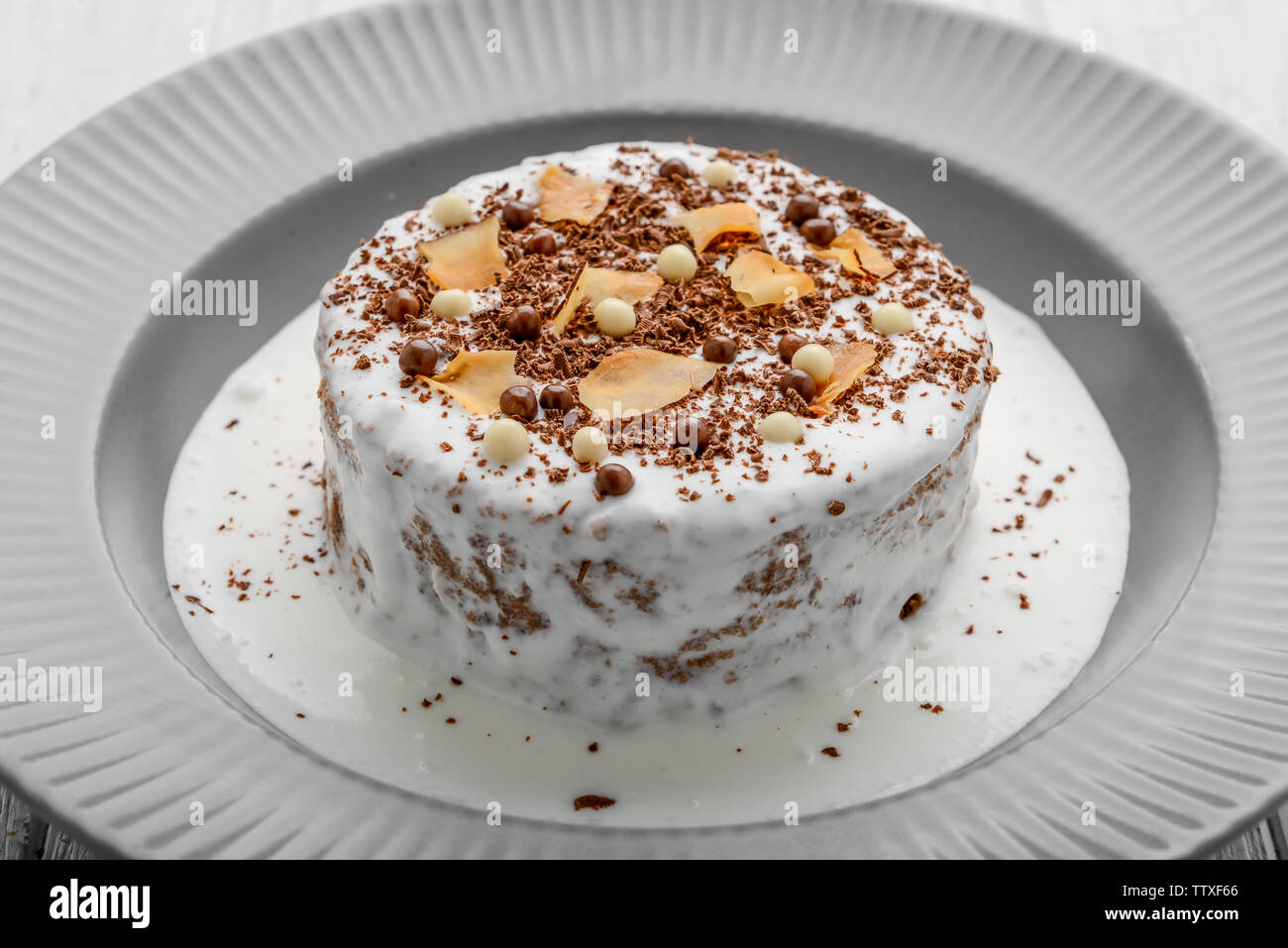 Meringue cake with chocolate cream and nuts Stock Photo Alamy