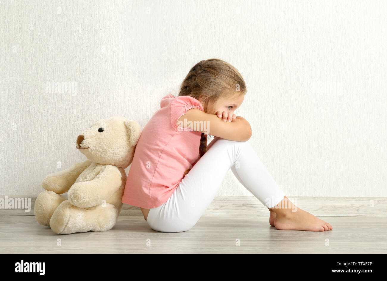 little girl with a teddy bear