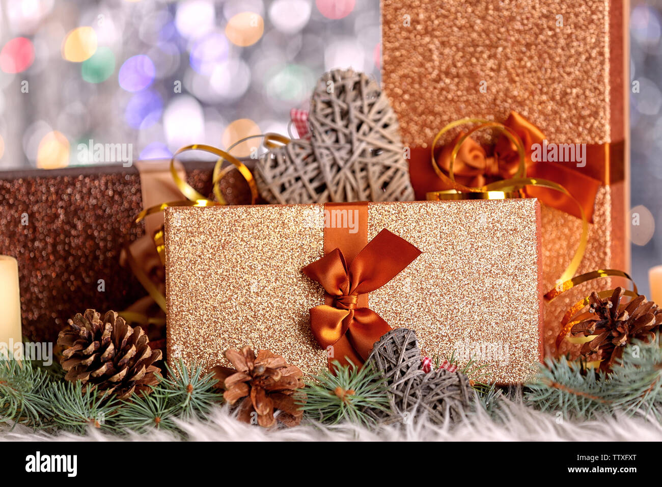 Christmas composition with gift boxes and decorations on bokeh ...