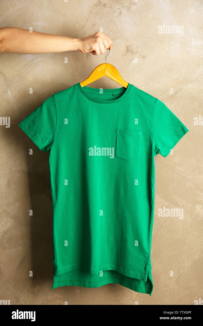 Blank green t-shirt on grunge background Stock Photo - Alamy