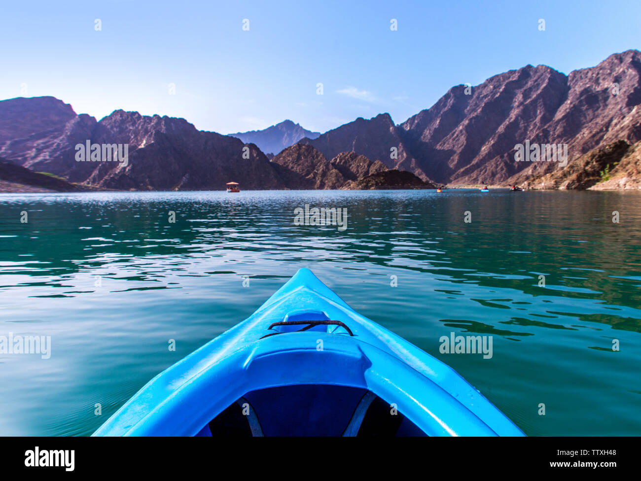 Boat ride kayaking at Hatta Dam awesome place to spend holidays beautiful mountain scenery Stock Photo
