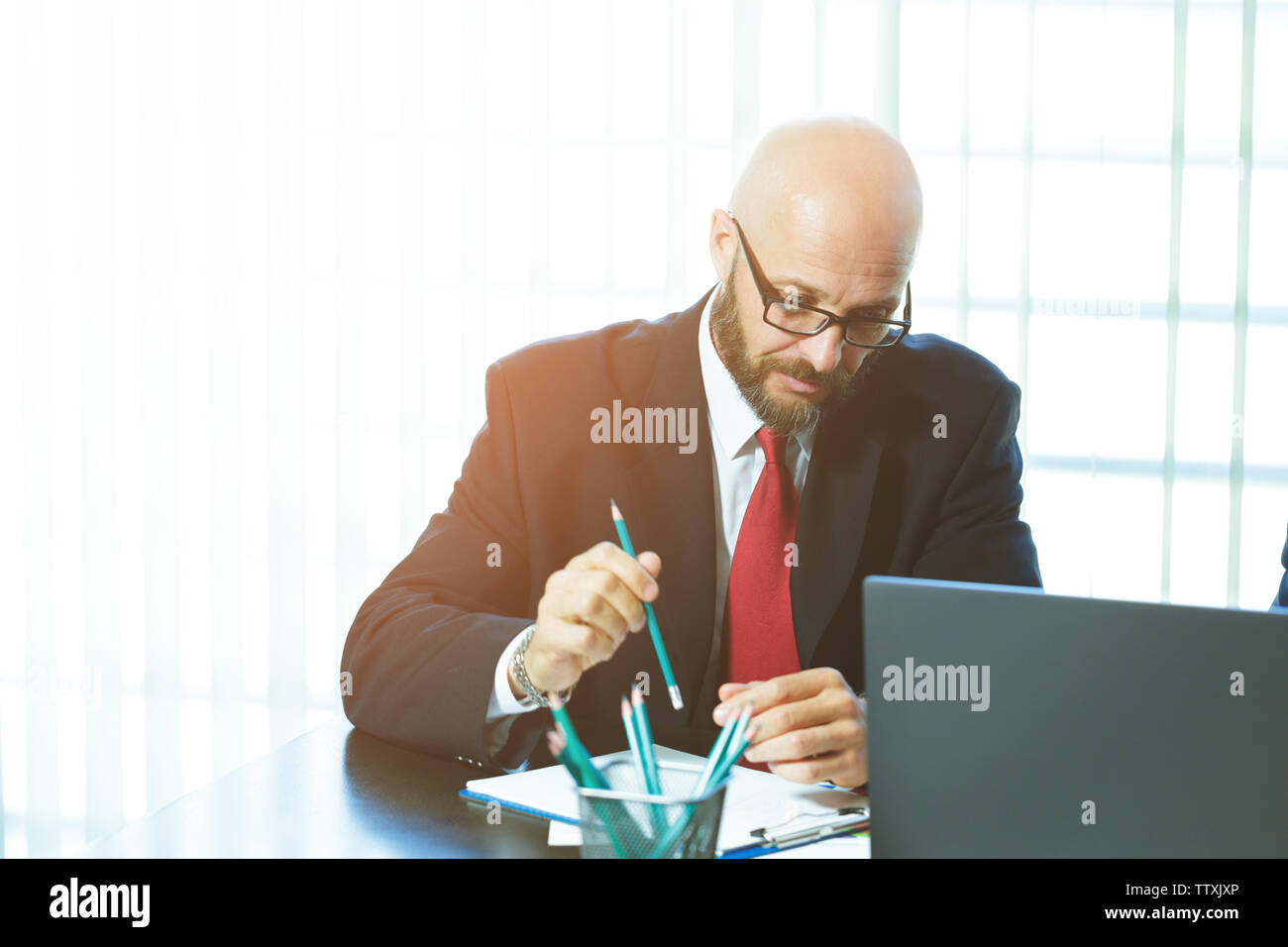 business man working with documents and laptop Stock Photo