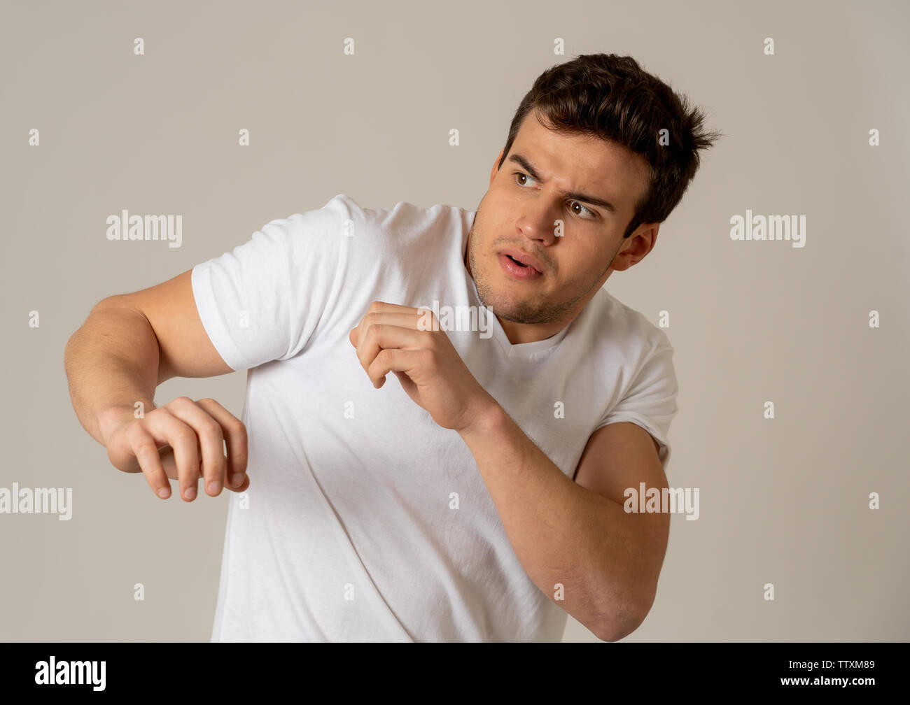 Portrait Of Young Man In Shock With A Scared Face Expression