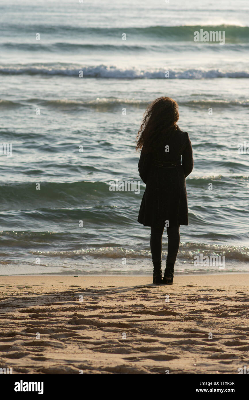 Woman dark hair back view coat hi-res stock photography and images - Alamy