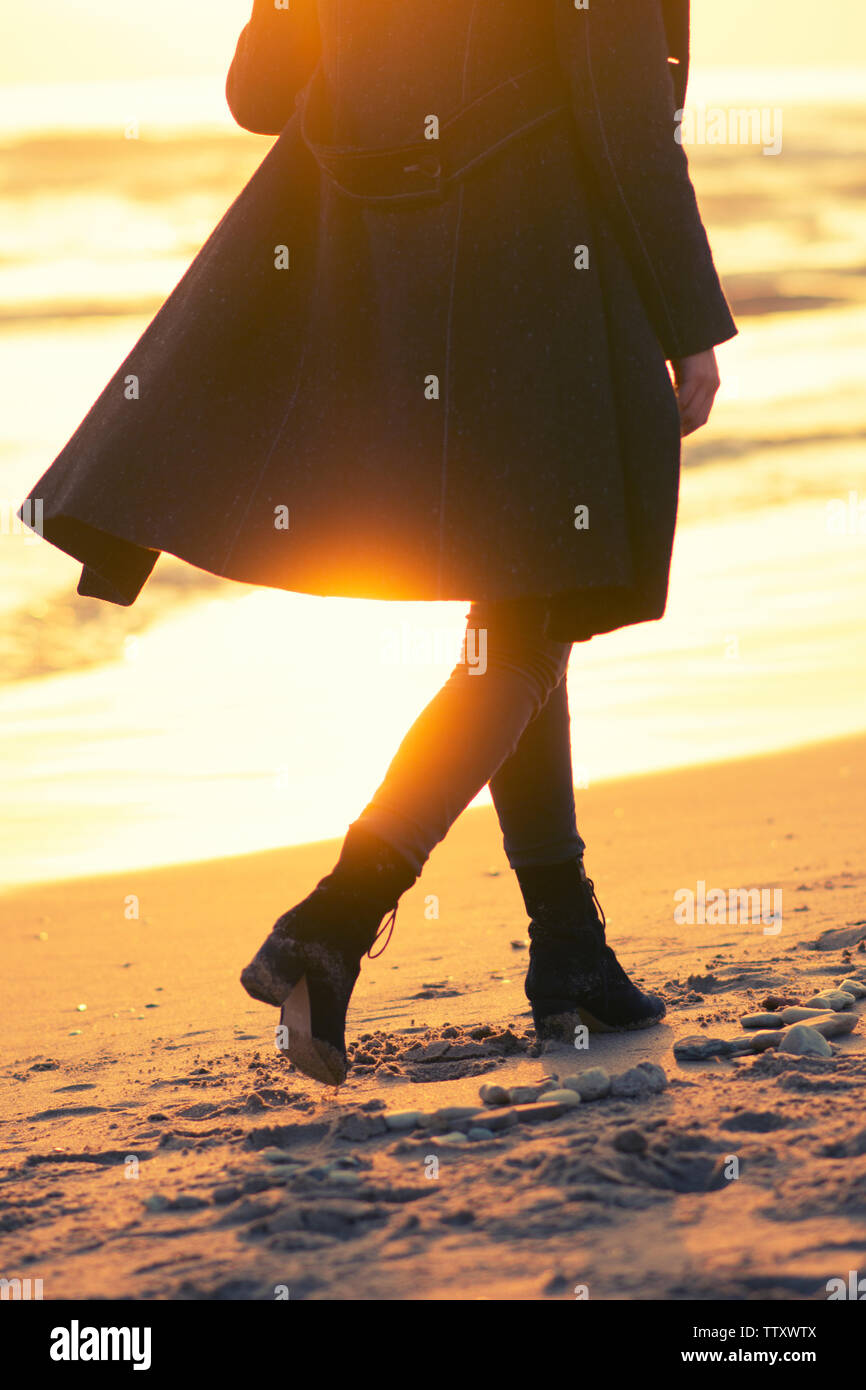 Back view woman walking sea hi-res stock photography and images - Alamy