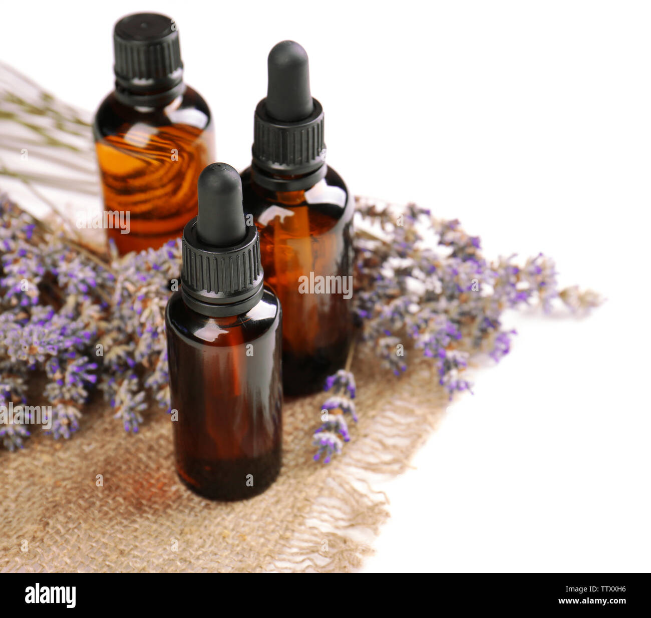Bottles with essential oil and lavender on white background Stock Photo ...