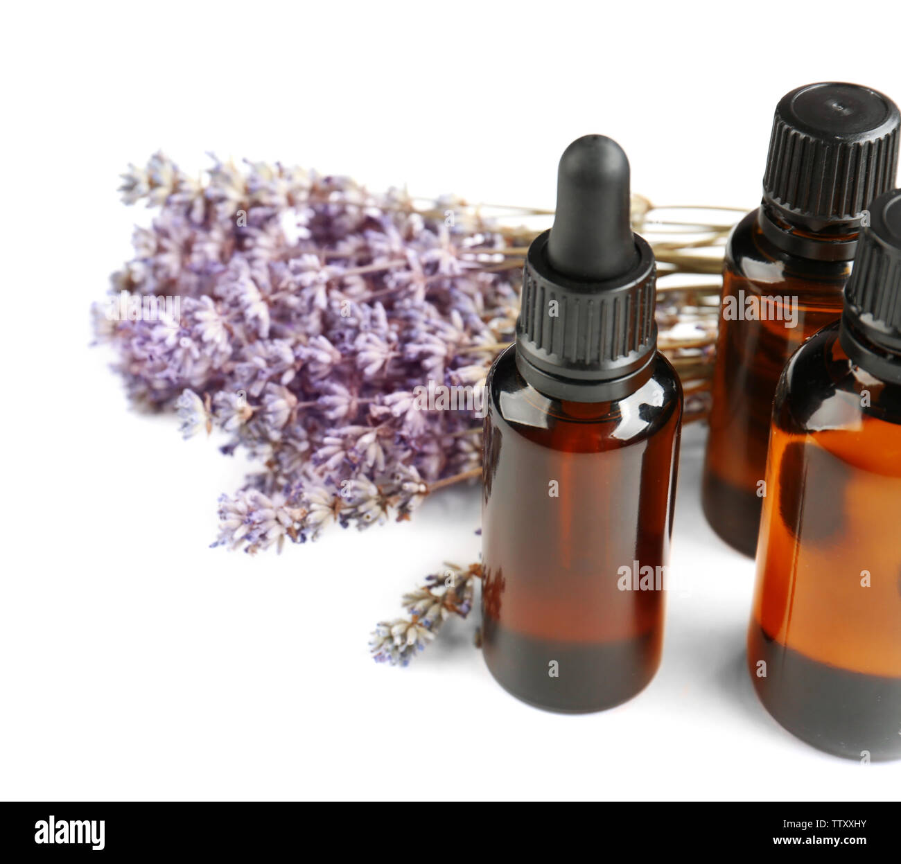 Bottles with essential oil and lavender on white background Stock Photo ...