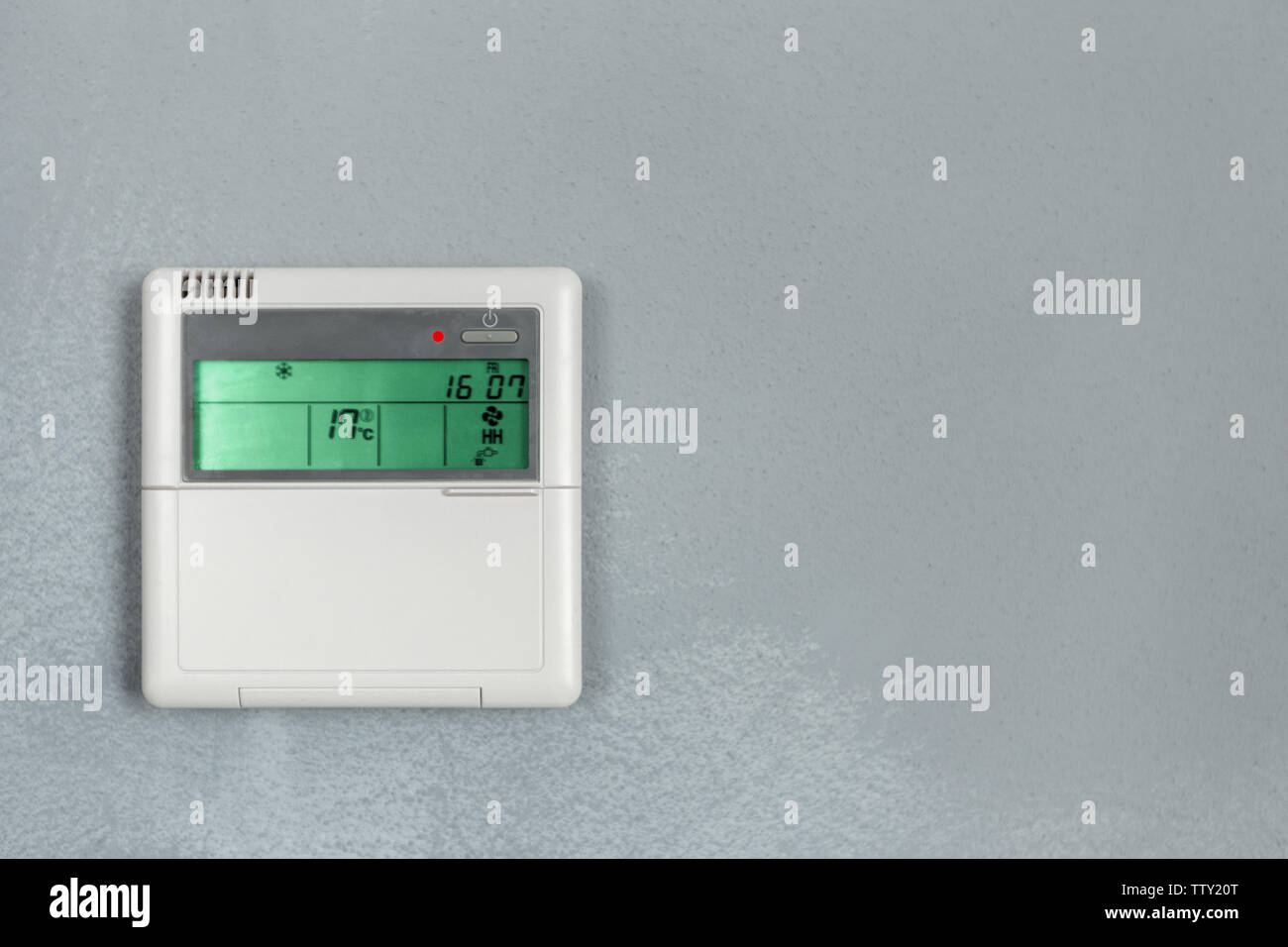 Air conditioner control, thermostat digital programmable on wall Stock