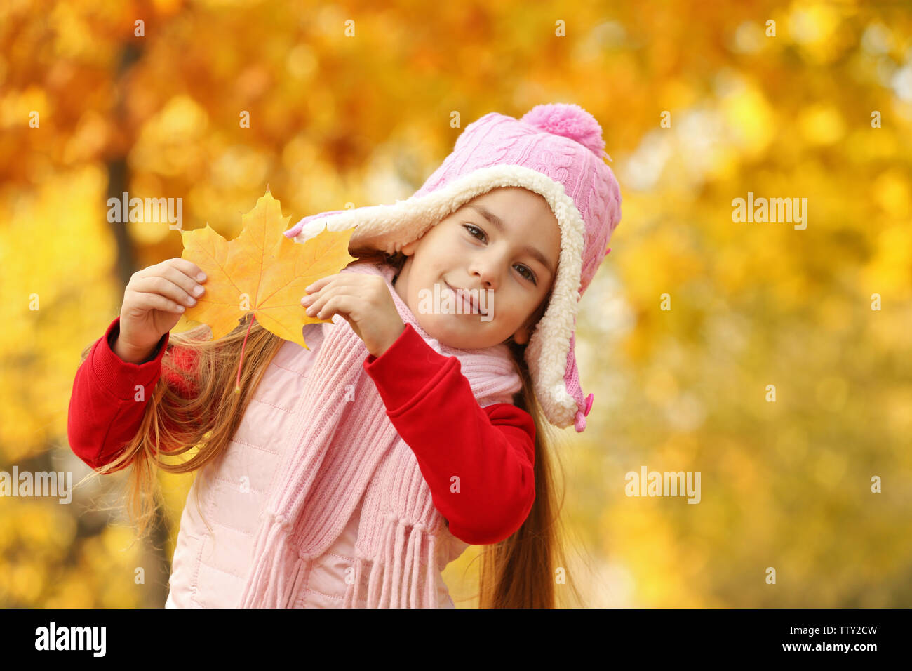 Portrait of cute little girl with leaf Stock Photo - Alamy