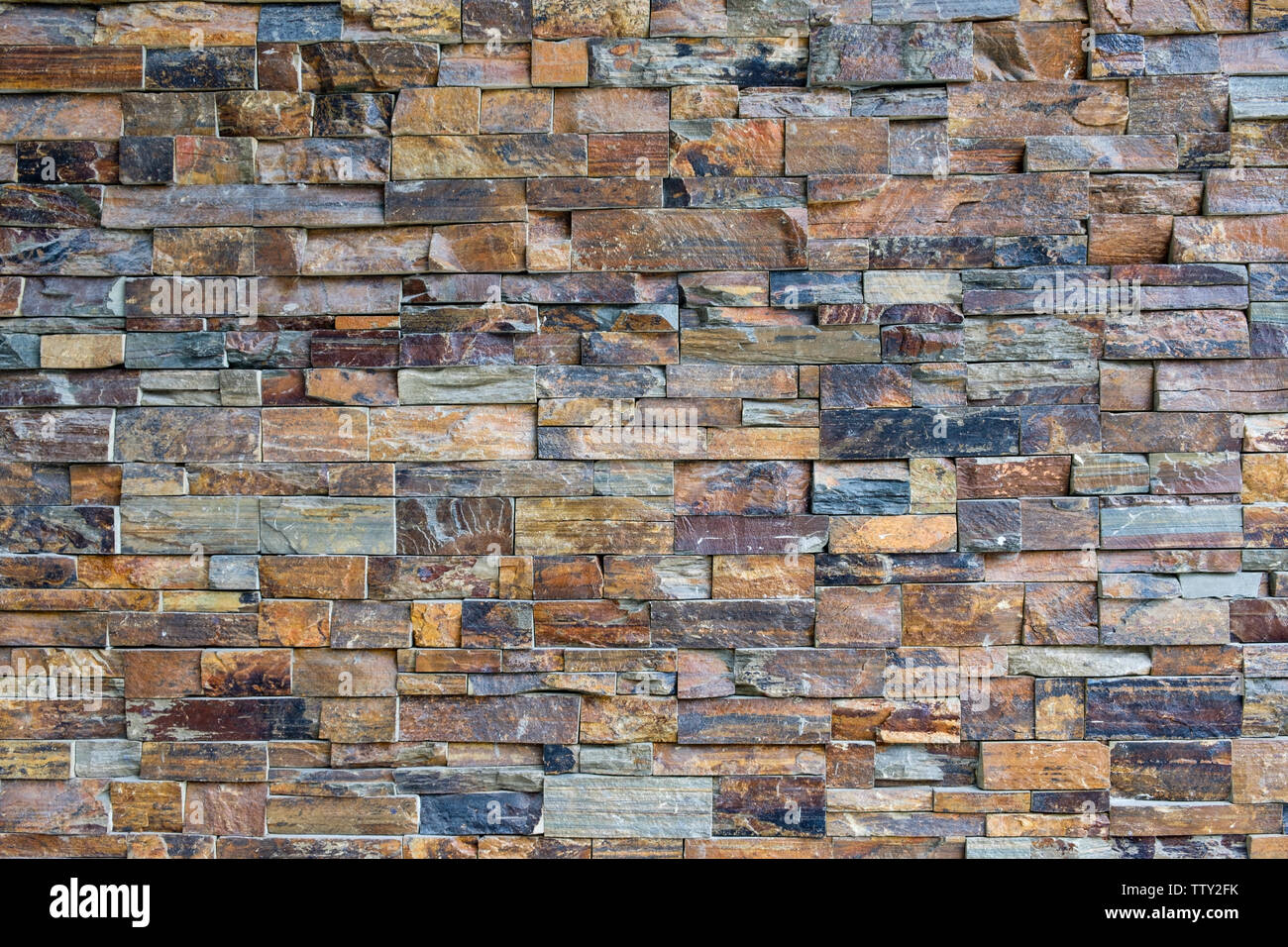 Stone brick wall decorative pattern background Stock Photo