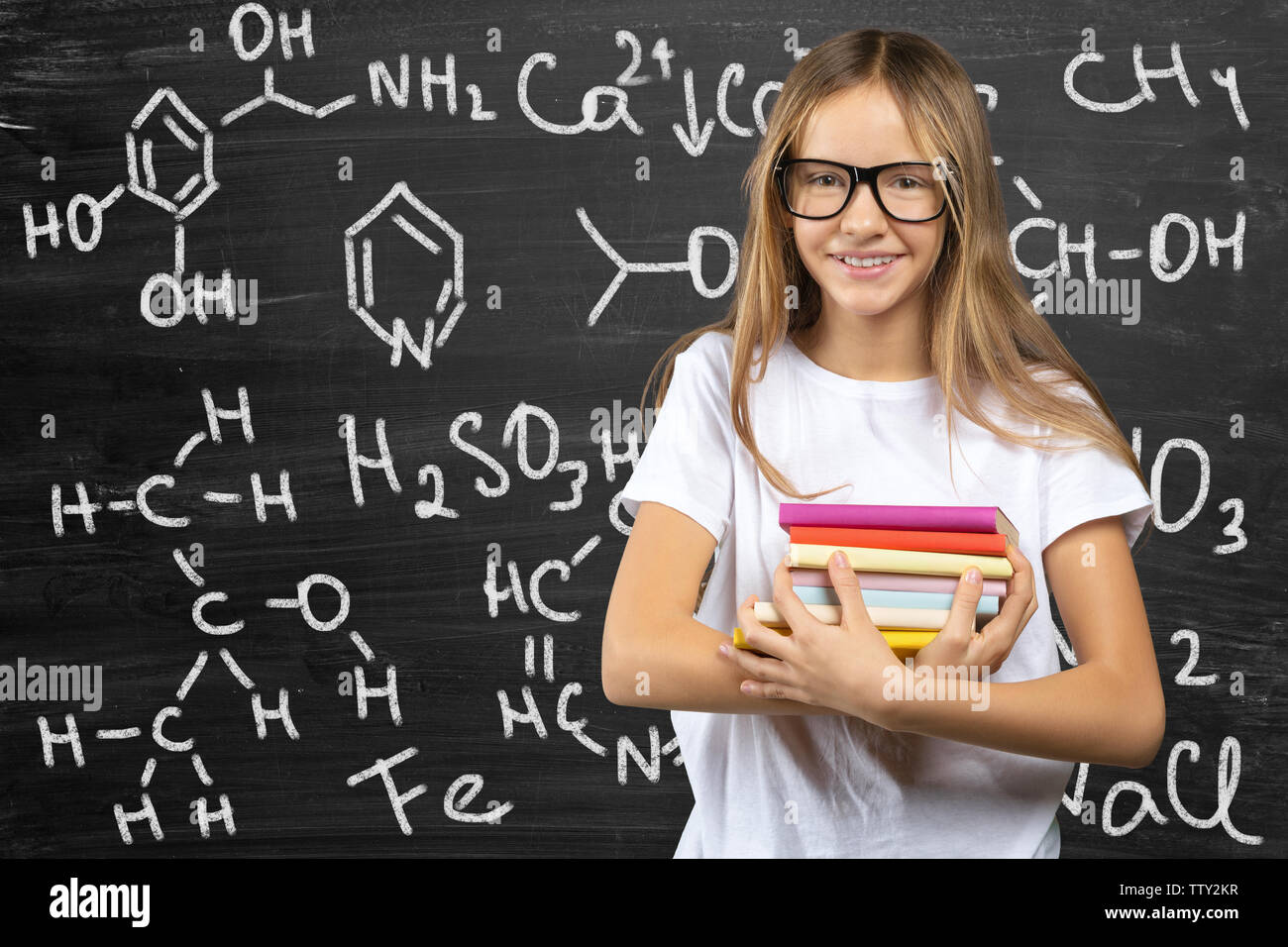 Portrait of smiling school girl child in class Stock Photo - Alamy