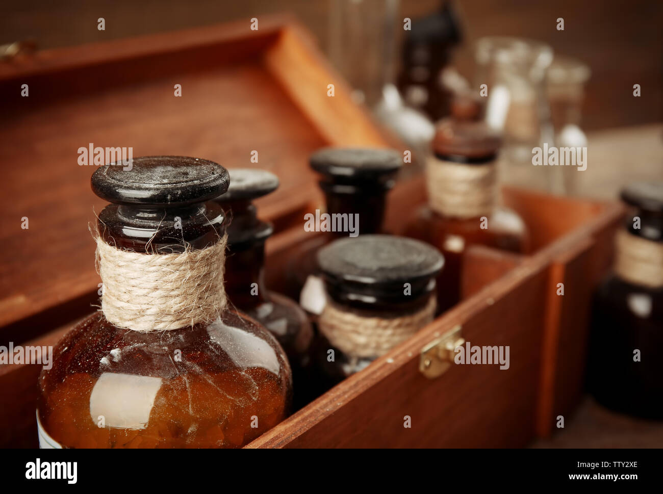 Vintage glass bottles in wooden box, closeup Stock Photo