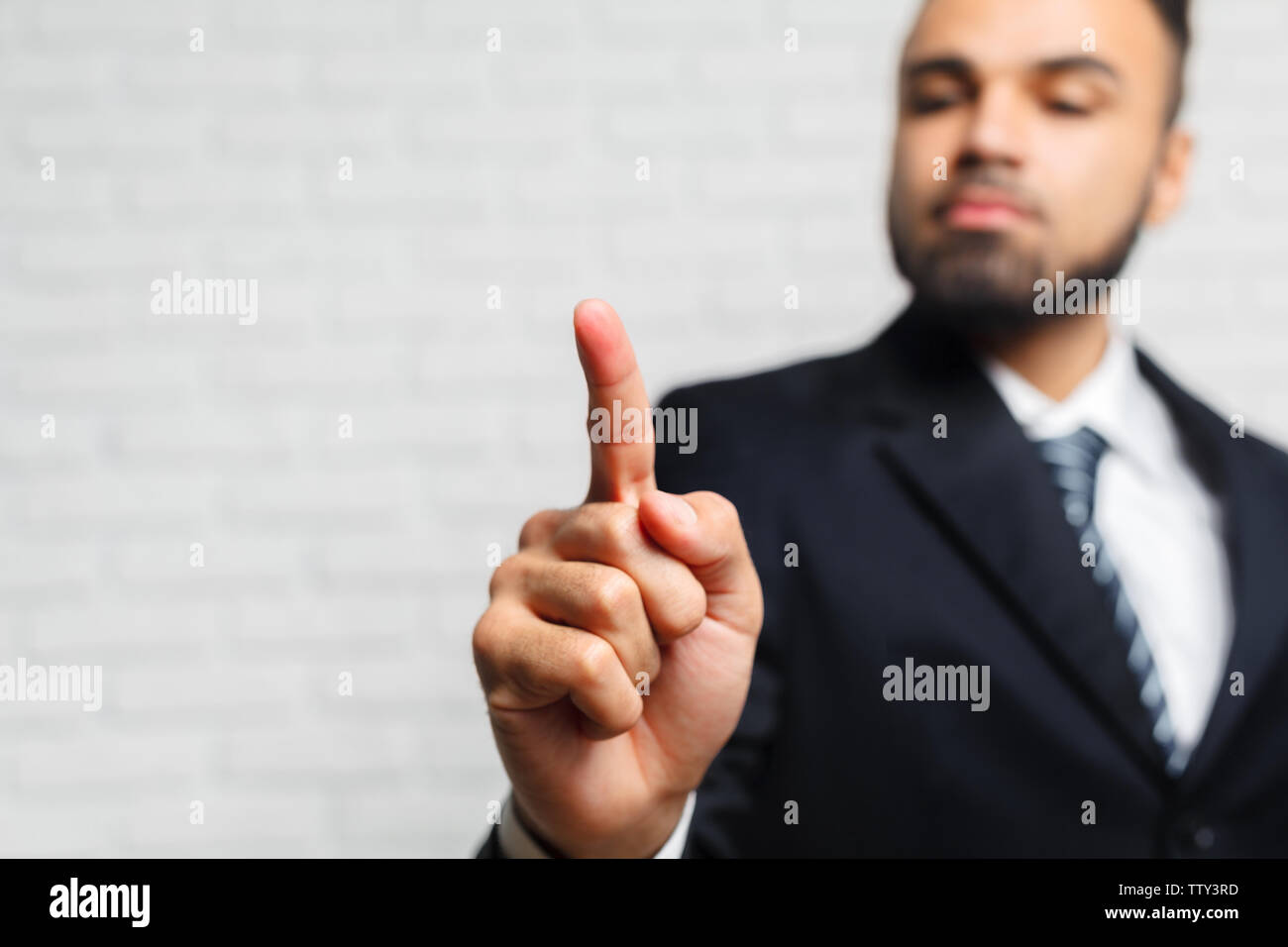 Business man touching an imaginary screen Stock Photo