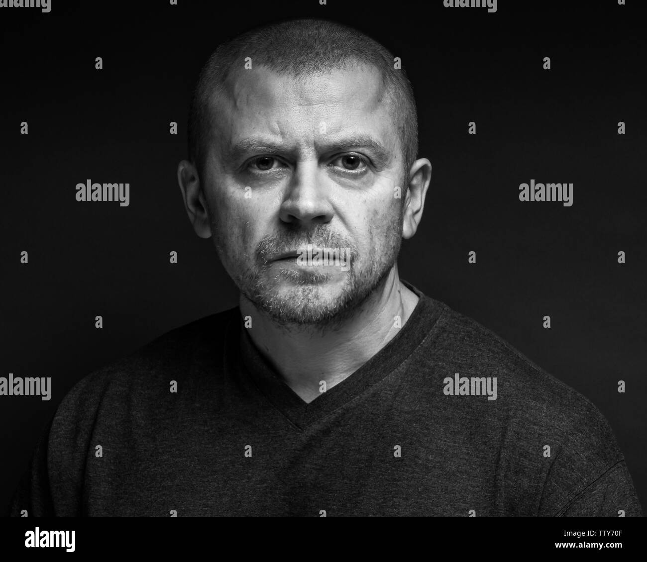 Black and white portrait of a man in studio Stock Photo - Alamy