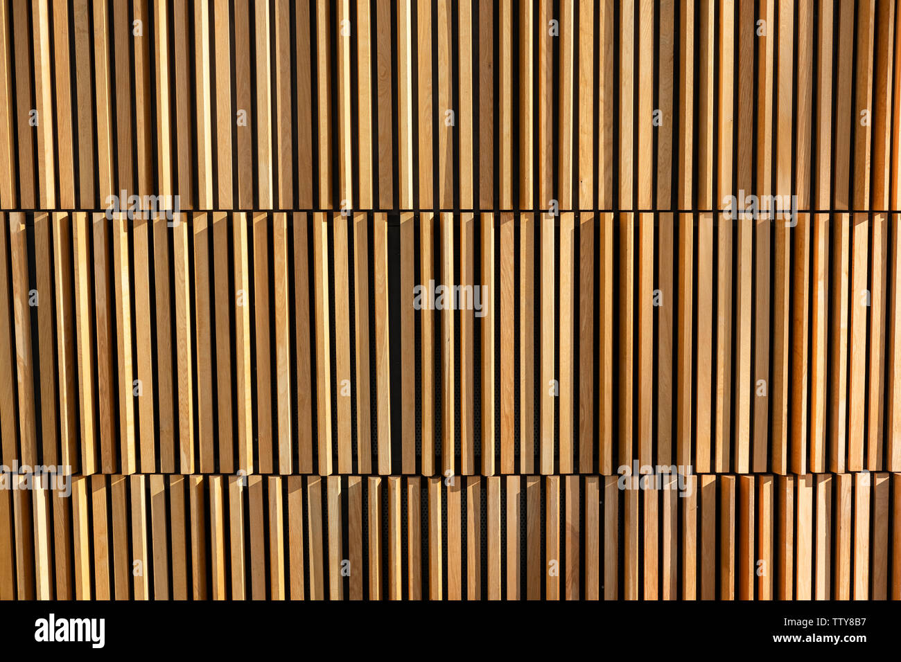 Striped Wooden with light and shadow decoration on wall background Stock Photo