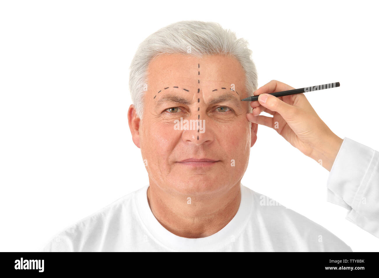 Female hand drawing correction line on man's face on white background Stock Photo