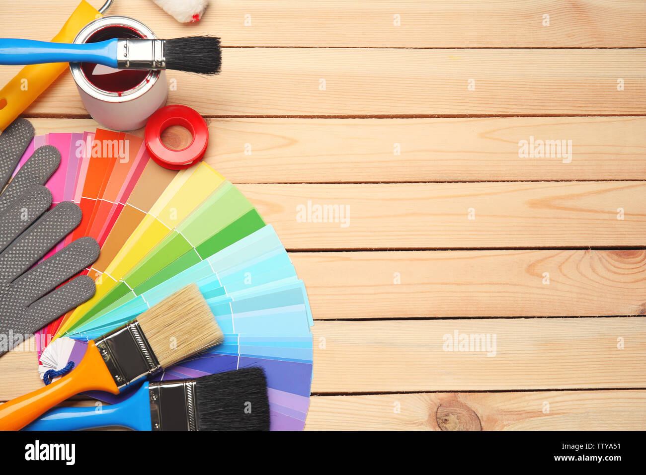 Color swatches and tools on wooden background Stock Photo - Alamy