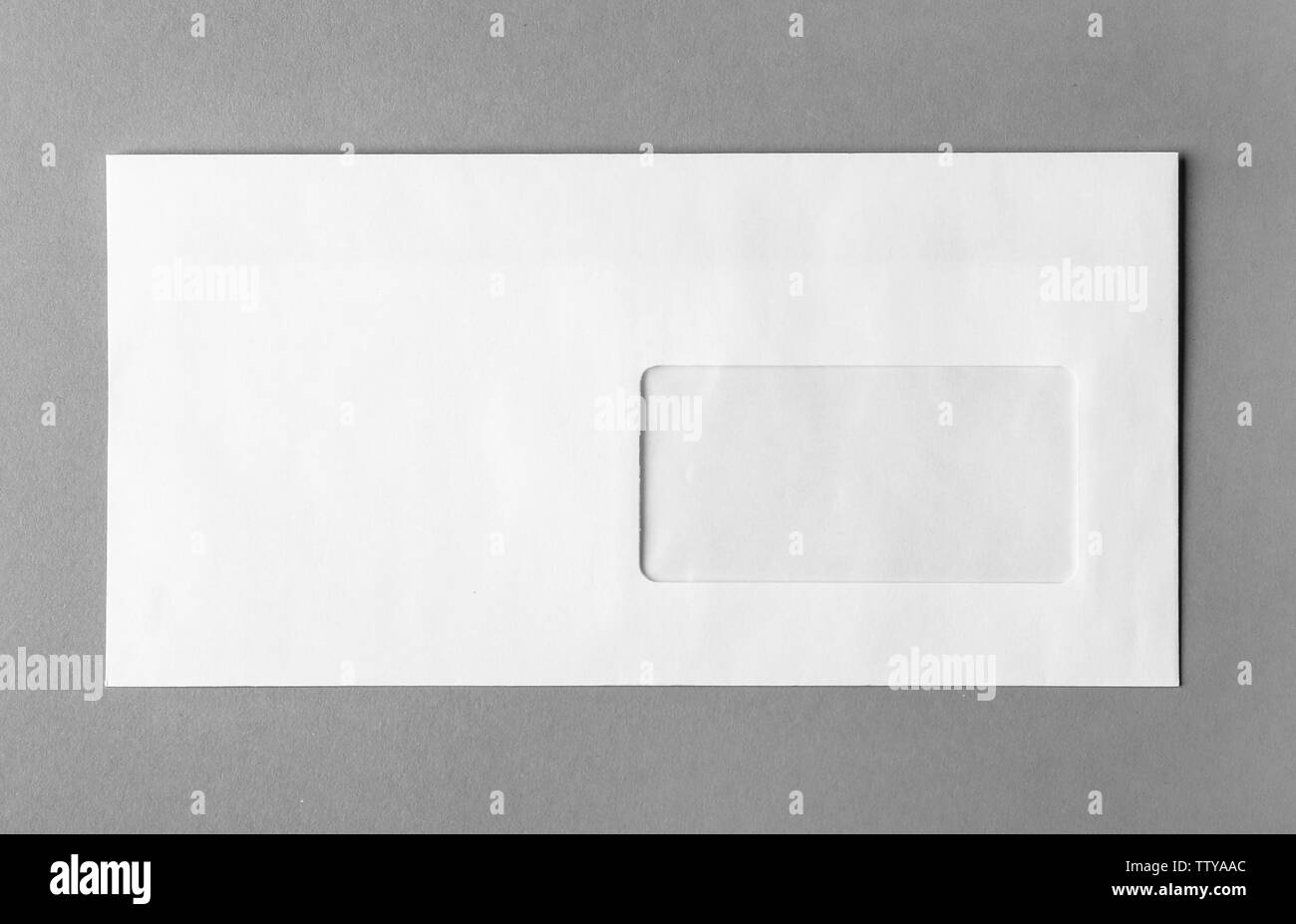 Blank white envelope on grey background Stock Photo Alamy