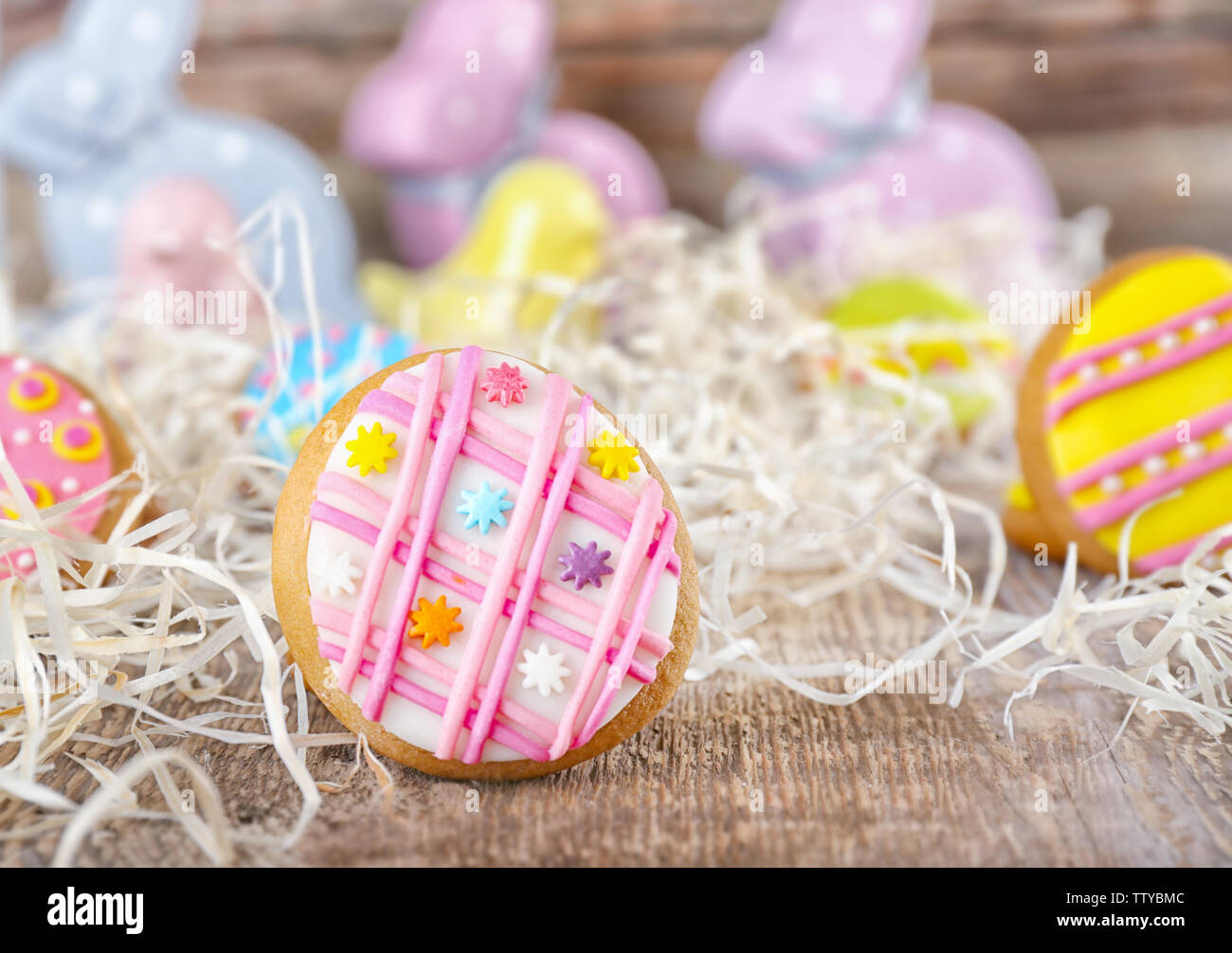 Creative Easter cookies and decorations on wooden table, closeup Stock Photo