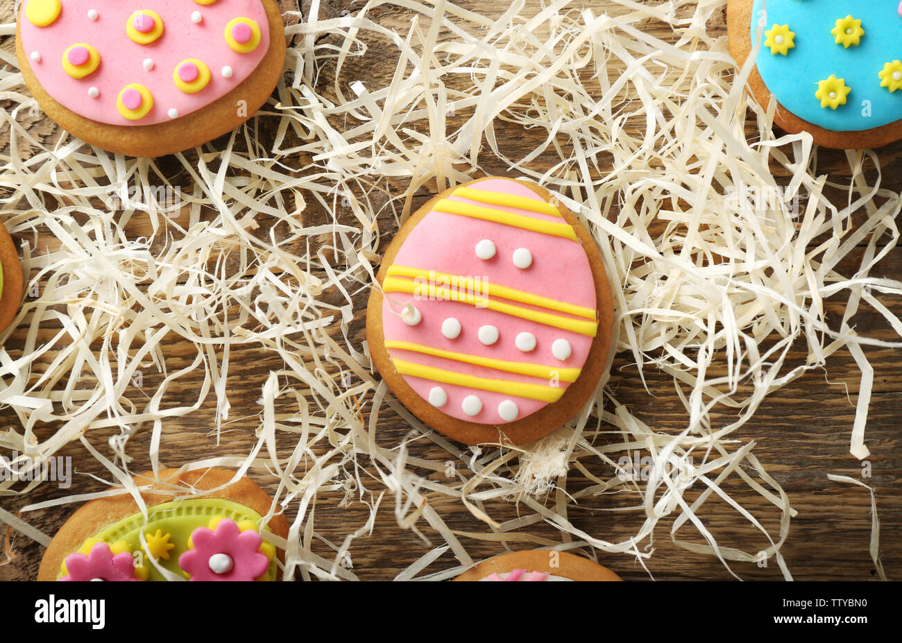 Creative Easter cookies and decorations on wooden table, closeup Stock Photo