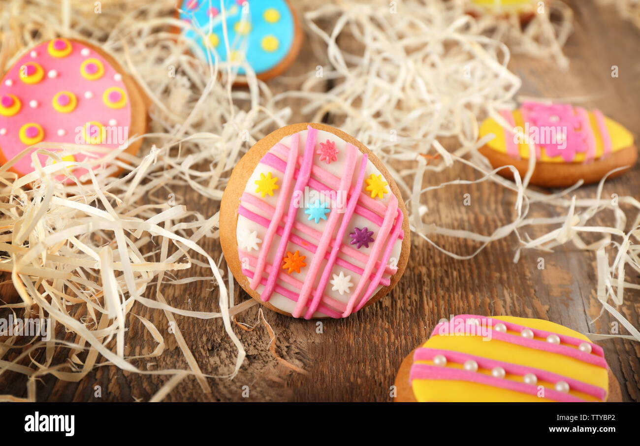 Creative Easter cookies and decorations on wooden table, closeup Stock Photo