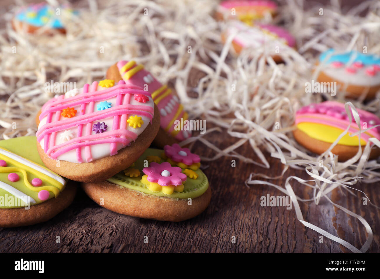 Creative Easter cookies and decorations on wooden table, closeup Stock Photo