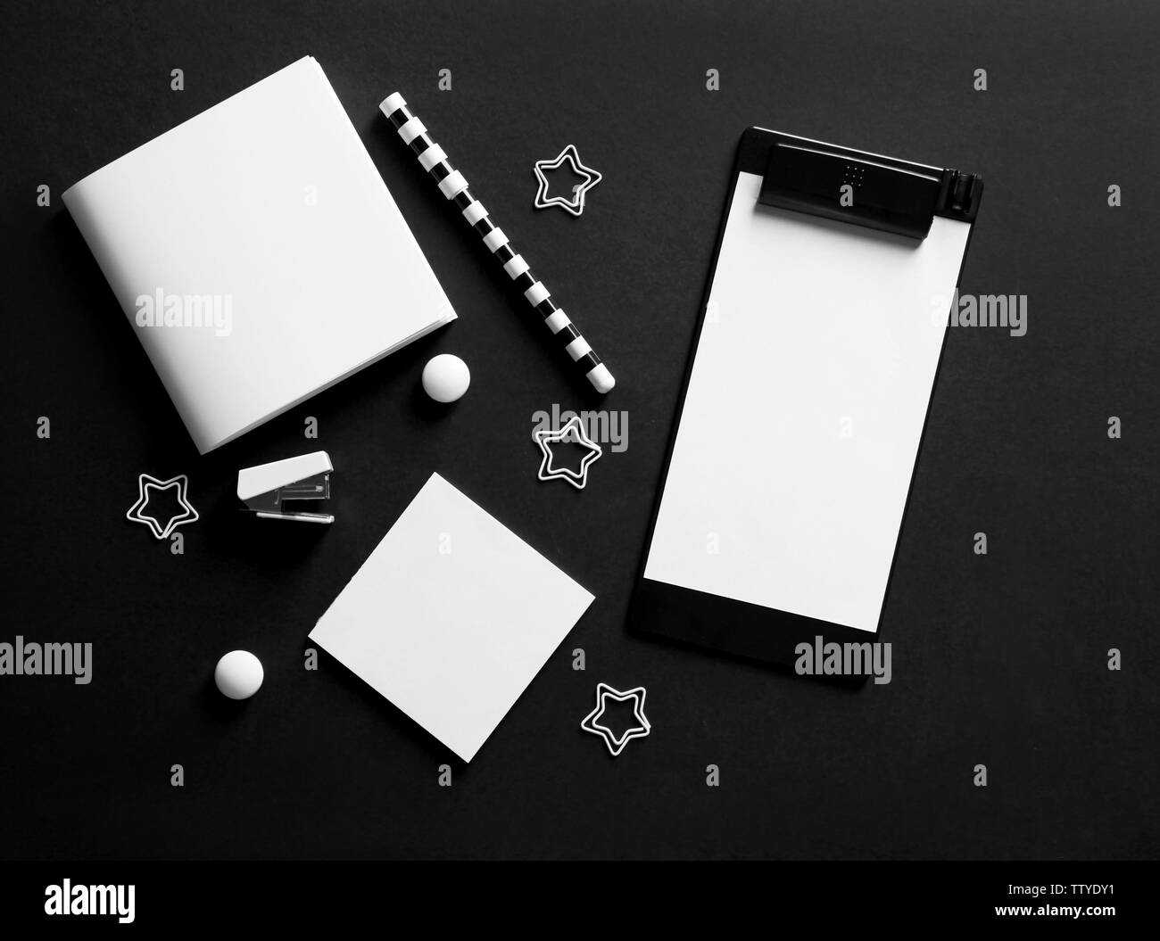 Flat lay of stationery on black background Stock Photo