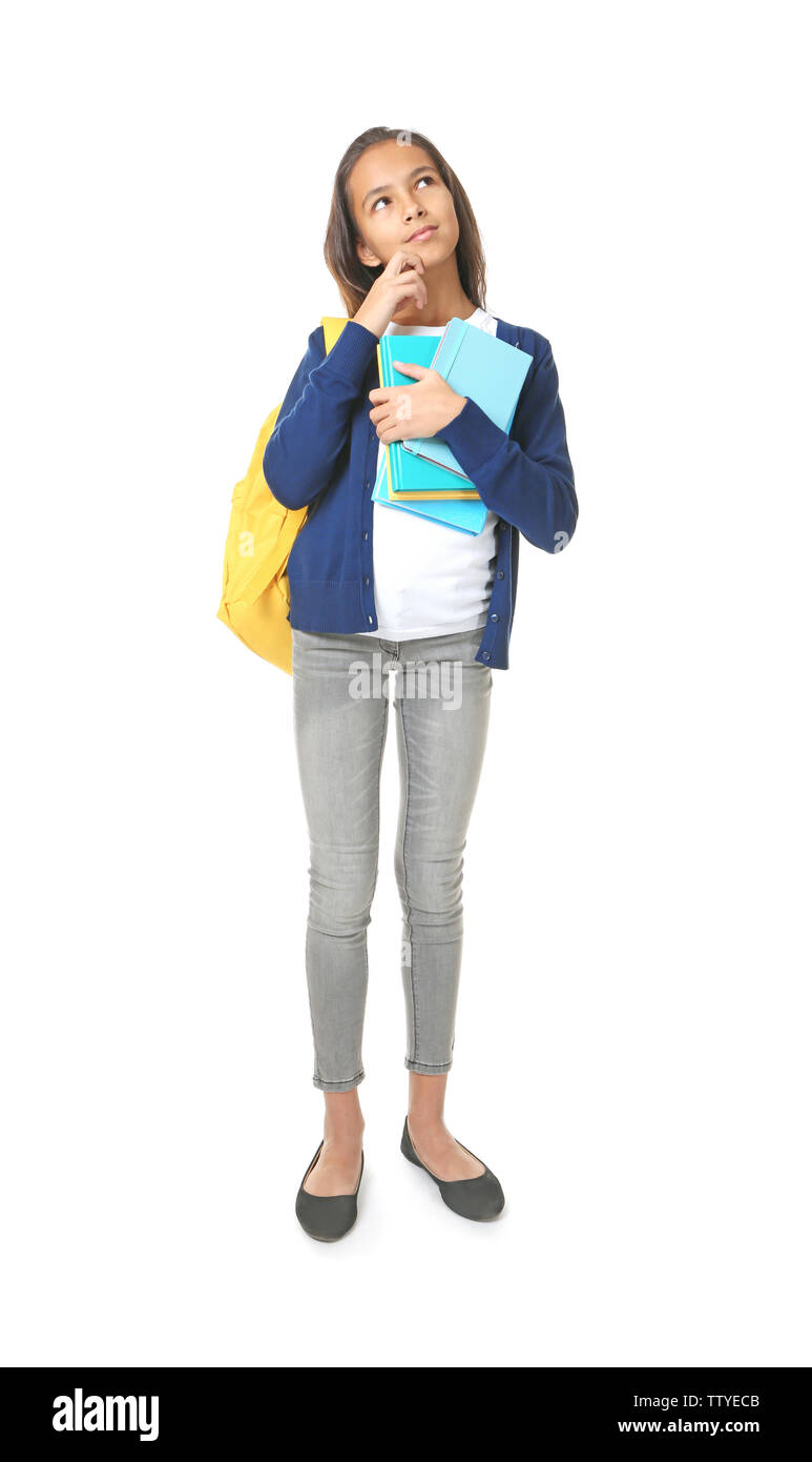 Cute schoolgirl with books on white background Stock Photo - Alamy