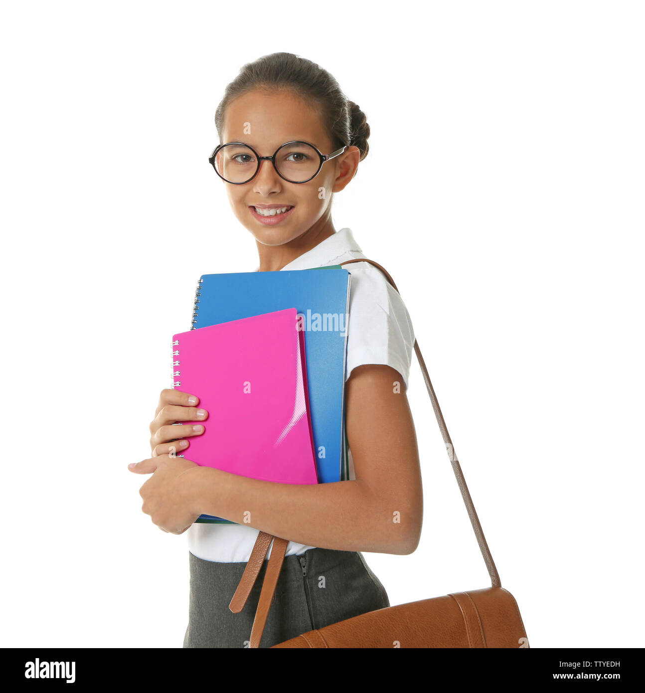 Cute schoolgirl on white background Stock Photo - Alamy