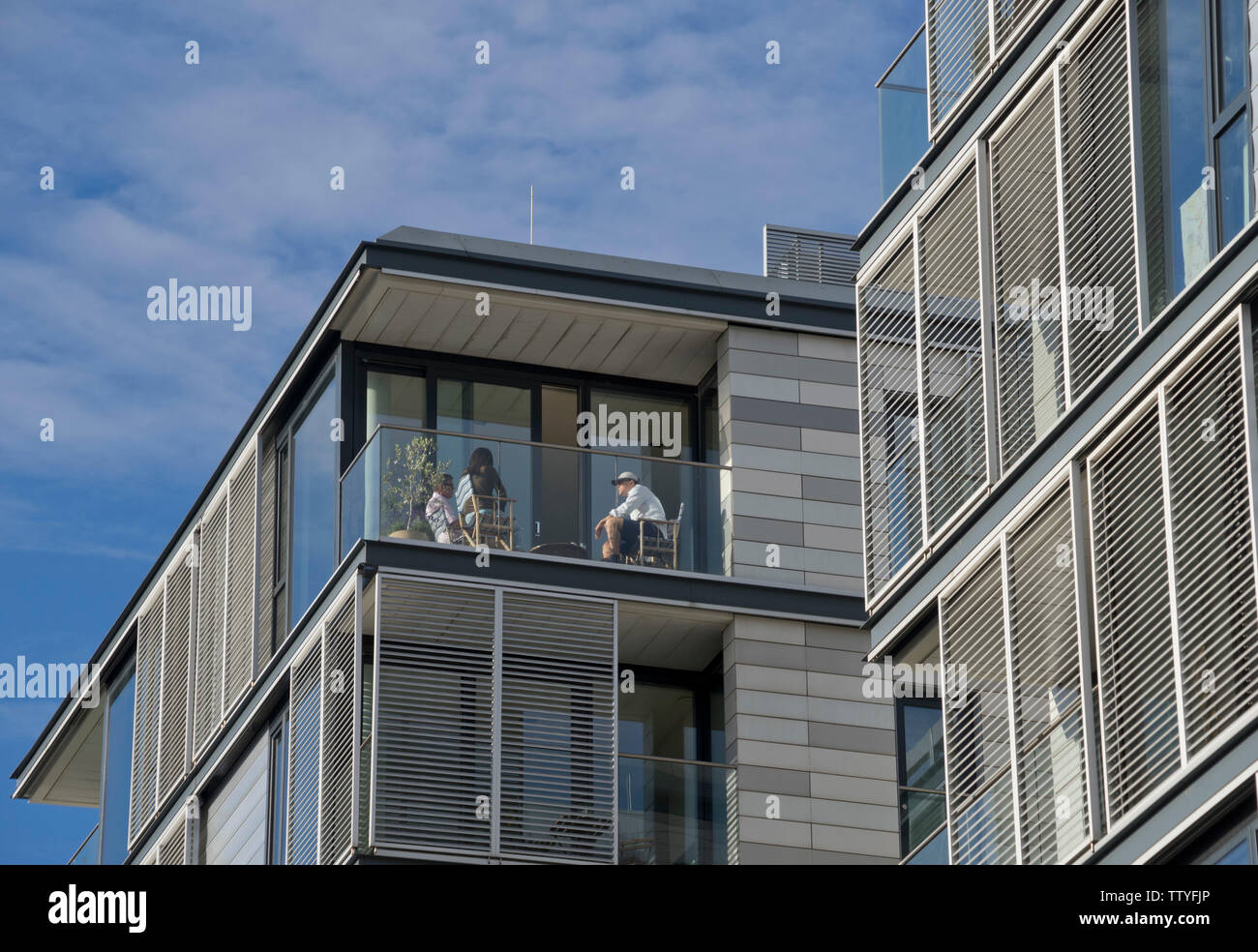 Modern apartment balcony on canal by Coal Drops Yard new building, shopping, bar and restaurant